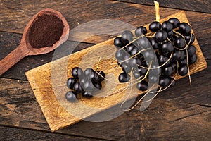 Acai berry powder in spoon - Euterpe oleracea photo