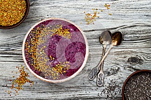 Acai breakfast superfoods smoothies bowl with chia seeds, bee pollen toppings. Immune boosting, anti inflammatory smoothie