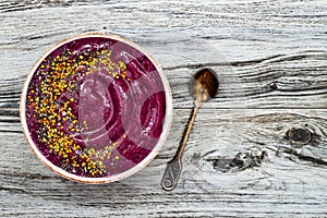 Acai breakfast superfoods smoothies bowl with chia seeds, bee pollen toppings. Immune boosting, anti inflammatory smoothie