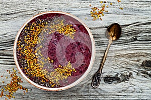 Acai breakfast superfoods smoothies bowl with chia seeds, bee pollen toppings. Immune boosting, anti inflammatory smoothie