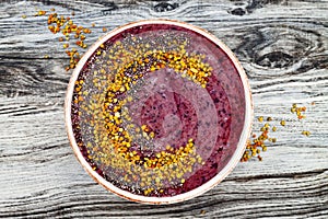 Acai breakfast superfoods smoothies bowl with chia seeds, bee pollen toppings. Immune boosting, anti inflammatory smoothie