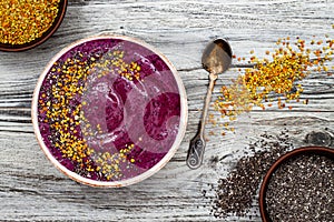 Acai breakfast superfoods smoothies bowl with chia seeds, bee pollen toppings. Immune boosting, anti inflammatory smoothie photo