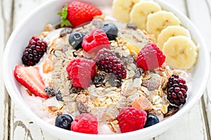 Acai fruit bowl with muesli cereal,berries and bananas