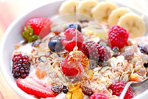 Acai fruit bowl with muesli cereal photo