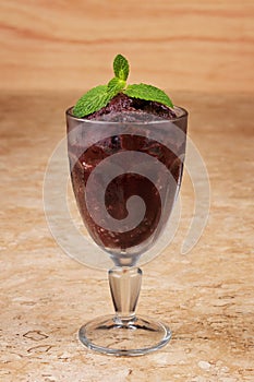 Acai pulp in glass with fresh mint