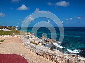 Acantilado del Amanecer Cliff of the Dawn at Punta Sur point on Isla Mujeres (island) with the Caribbean ocean in the ba photo