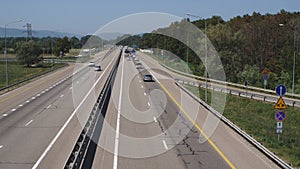 Accelerated shooting of a high-speed highway with a traffic jam. People go to the Black Sea coast