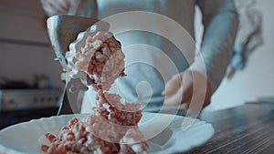 Accelerated Video. Male Hands In A Light Kitchen Make Stuffing On A Handmade Old Meat Grinder. Cooking Minced Meat at