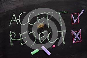 Accept or Reject written with color chalk concept on the blackboard