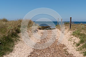 Access beach of isle Noirmoutier by sand pathway in Vendee France