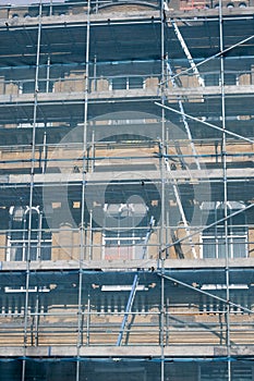 Access ladders within netted scaffolding