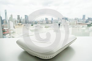 Access point on the office desk with city view