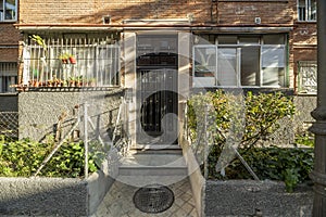 Access portal from the street to a residential building of modest