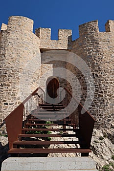 Access stairs to the entrance door of the Almohad castle of Sax on top of a rock. Sax, Alicante, Spain