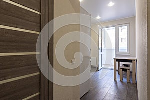 Access to the kitchen in a studio apartment photo