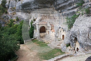 Access to National Monument Ojo Guarena. Caves and church in the rocks. Merindades, Burgos, photo