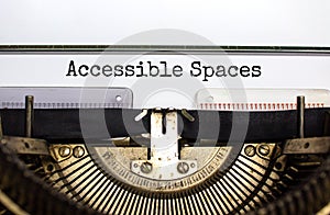 Accessibility and accessible spaces symbol. Concept words `Accessible spaces` typed on old retro typewriter. Diversity, inclusio