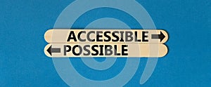 Accessible or possible symbol. Concept word Accessible or Possible on beautiful wooden stick. Beautiful blue table blue background
