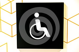 Accessible Restroom Sign with Geometric Background