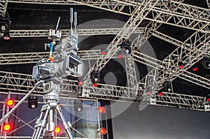 Accessories for 4k TV camera in a concert hall with laser lighting. Professional digital video camera.