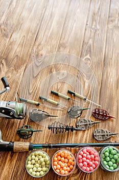 Accessories for carp fishing and fishing baits on wooden planks with copy space
