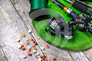 accessories for fishing on a wooden background. selective focus.