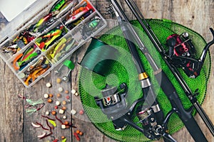 accessories for fishing on a wooden background. selective focus.