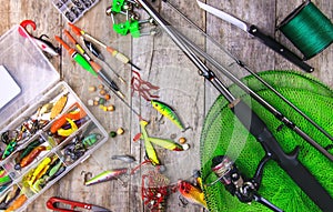 accessories for fishing on a wooden background. selective focus.