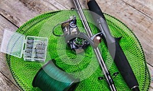 accessories for fishing on a wooden background. selective focus.