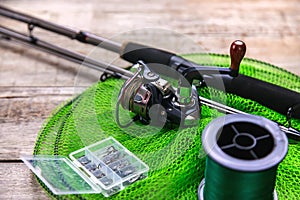 accessories for fishing on a wooden background. selective focus.