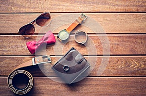 Accessories for men on the wooden floor.