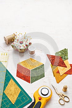 Accessories for quilting top view on a white surface. Space for text