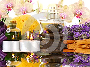 Accessories for spa with orchids, lavender, stones, candles and