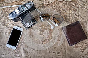 Accessories for travel,wallet,photo camera, smart phone,sunglass,smalltalk and travel map photo