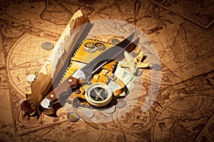 Accessories for the traveler on background of old maps.