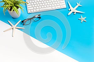 Accessories of traveler on blue and white background with copy space, Travel concept, Overhead view of Traveler`s accessories,
