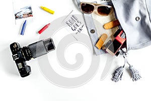 Accessories for treveling with children, camera and toys on white background top view mock-up