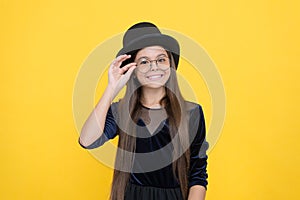 Accessorize and protect your eyesight. Happy child wear glasses yellow background. Corrective glasses for kids. Fashion