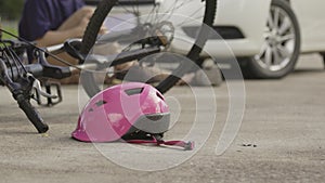 Accident bicycle crashes car after stunt on street.