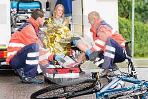 Accident bike woman get emergency help paramedics photo