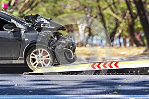 Accident Car Slide on truck for move. Black car have damage by accident on road take with slide truck move