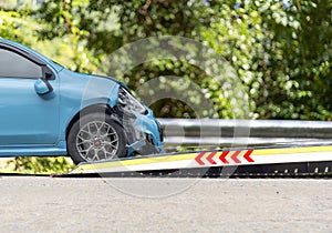 Accident Car Slide on  truck for move. blue car have damage by accident on road take with slide truck move