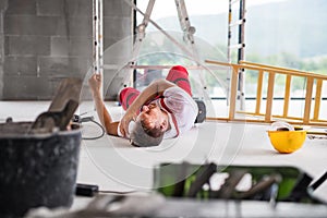 An accident of a man worker at the construction site. photo
