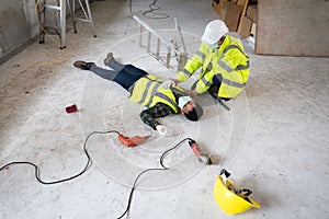 An accident of a man worker at the construction site. The assist those injured in the primary. Selection focus on an Injured