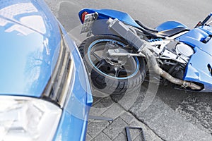 Accident motorcycle and cars on road