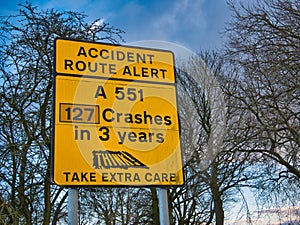 An accident route alert sign in the UK. The sign warns that drivers should take extra care on a dangerous stretch of road.