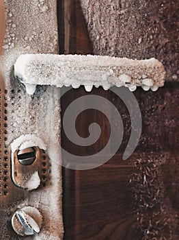 Accident situation - there is no heating in the house. Thermometer Cold. Frozen door. Frozen Door handle all on ice - temperature