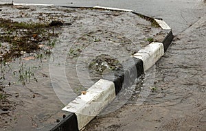 Accident of water supply, sewage. From under the crack in the asphalt poured a water fountain of dirty sewage. Breakthrough