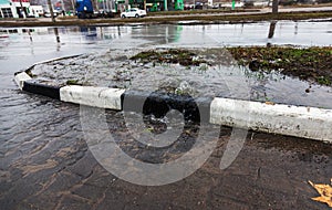 Accident of water supply, sewage. From under the crack in the asphalt poured a water fountain of dirty sewage. Breakthrough