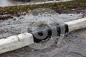 Accident of water supply, sewage. From under the crack in the asphalt poured a water fountain of dirty sewage. Breakthrough